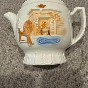 Cozy Ceramic Teapot with Fireplace Motif